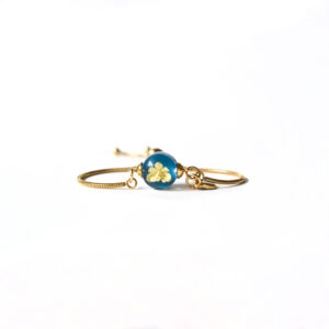 Pulsera  Florece azul bondi/dorada