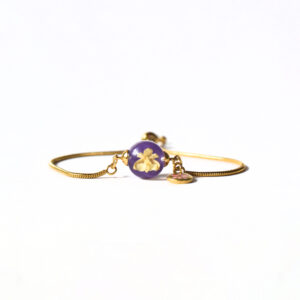 Pulsera Florece morado/dorada